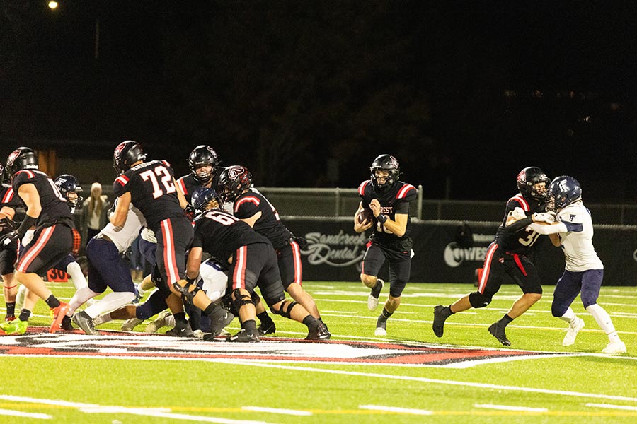 Hillcrest Tyson Sweetwood runs through a massive hole created by the Hillcrest offensive line. | Photo courtesy Amy Ward