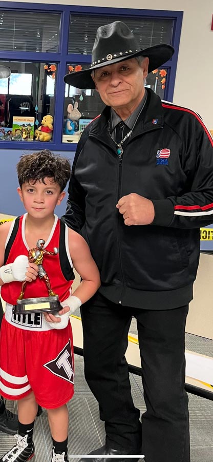Hall of Fame boxing coach Nars Martinez with E.J. Chavez of Idaho Falls after a successful effort. | Courtesy Corey Taule