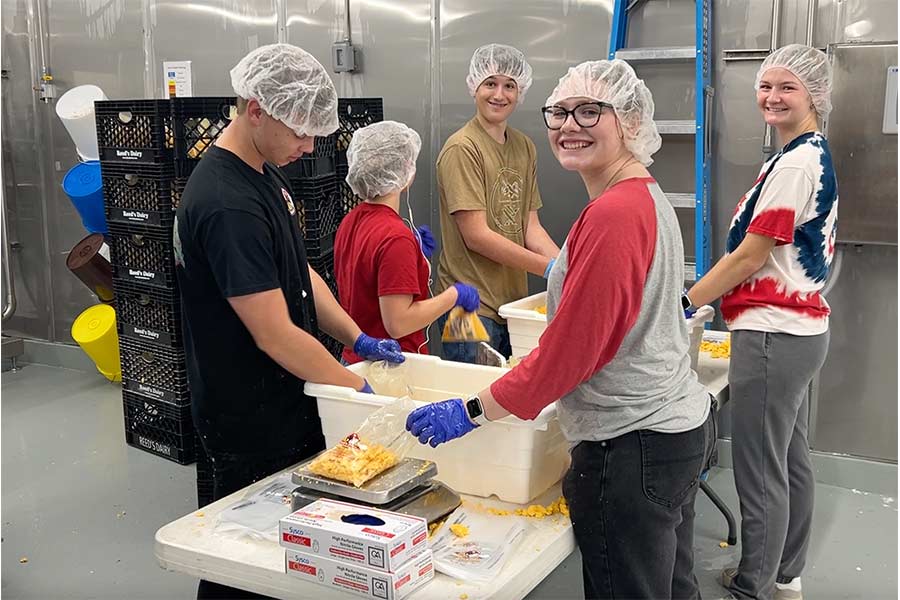 Reeds Dairy employees smile for the camera during a tour of the new building | Rett Nelson, EastIdahoNews.com