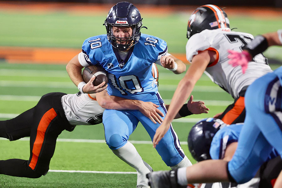 West Jefferson senior quarterback Ryker Burtenshaw scores late against Malad