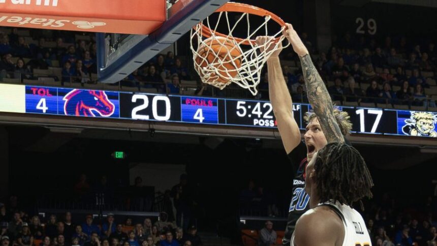 Boise State forward Drew Fielder dunks the ball after a baseline move on Wichita State forward Noah Hill in the first half at ExtraMile Arena in Boise, Tuesday, Nov. 18, 2025. Darin Oswalddoswald@idahostatesman.com