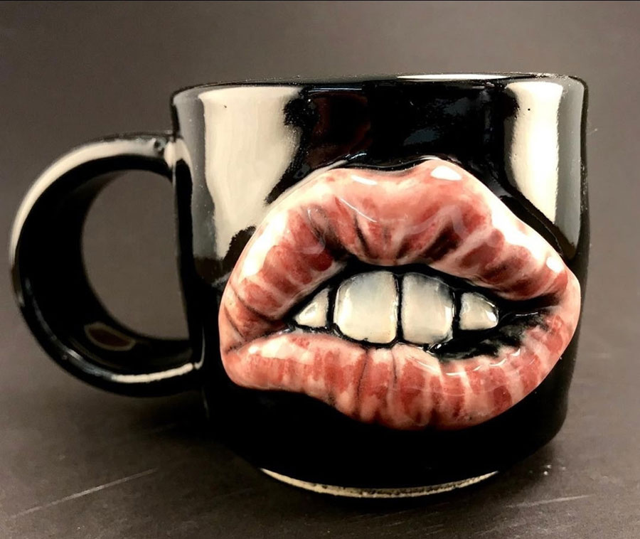 A coffee mug biting its lip