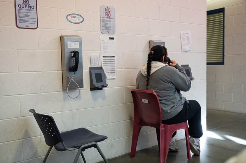 female inmate on phone