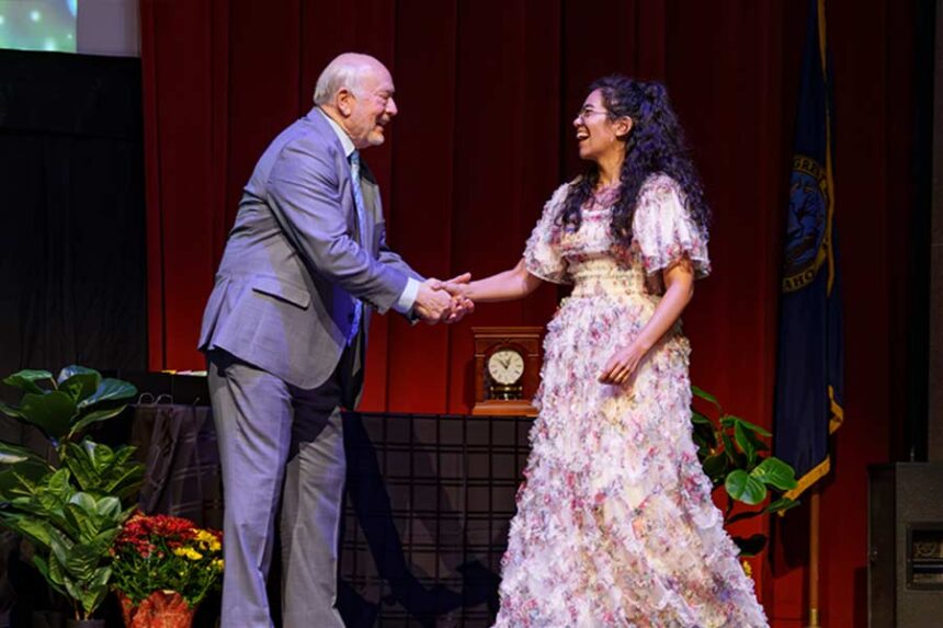 Melaleuca Executive Chairman Frank VanderSloot congratulates Melaleuca operations analyst Farah Stumpf for reaching a milestone anniversary. | Courtesy Melaleuca: The Wellness Company