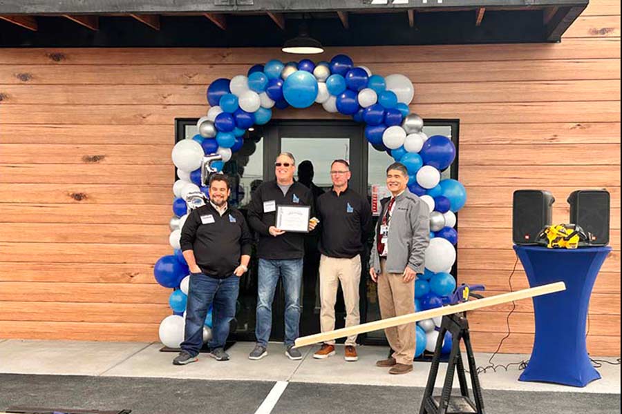 A member of the Greater Idaho Falls Chamber of Commerce, right, presented a certificate to company leadership Wednesday. On the left is CEO Levi Smith. Regional Manager Bryce Luker is next to him and Sales Manager John Rifelj. | Rett Nelson, EastIdahoNews.com