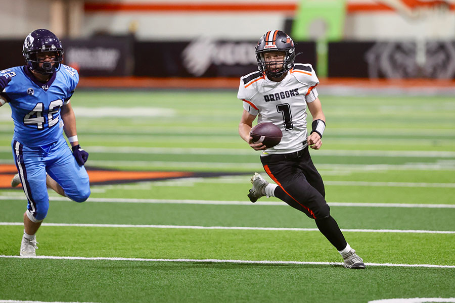 Malad junior quarterback Easton Green runs for a first down