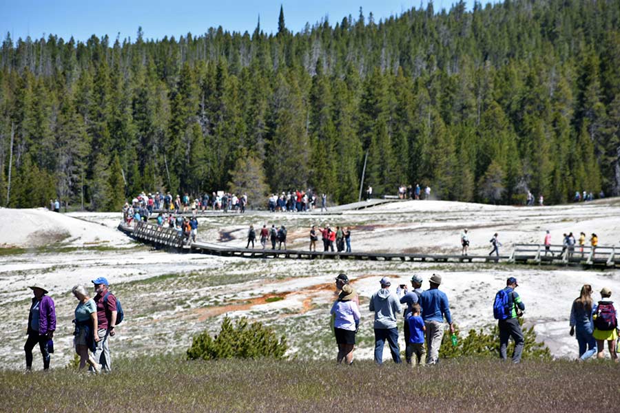 File - People hike at Glacier National Park in Montana. (AP Photo/Beth J. Harpaz, File)