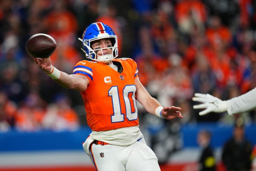 Denver Broncos quarterback Bo Nix (10) throws during the first half of an NFL football game against the Las Vegas Raiders Thursday, Nov. 6, 2025, in Denver. (AP Photo/Jack Dempsey)