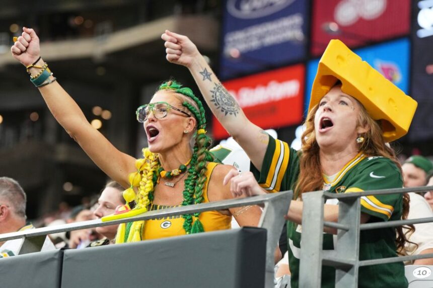 FILE - Green Bay Packers fans cheer during the first half of an NFL football game against the Arizona Cardinals Sunday, Oct. 19, 2025, in Glendale, Ariz. (AP Photo/Rick Scuteri, File)