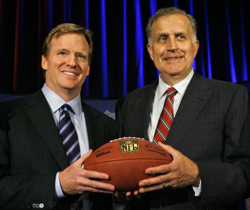 FILE - In this Aug. 8, 2006 file photo, Roger Goodell, left, the NFL's chief operating officer, and Paul Tagliabue, NFL commissioner, pose for photos after Goodell was selected to succeed Tagliabue as the league's new commissioner at an NFL meeting in Northbrook, Ill. AP Photo/M. Spencer Green, File)