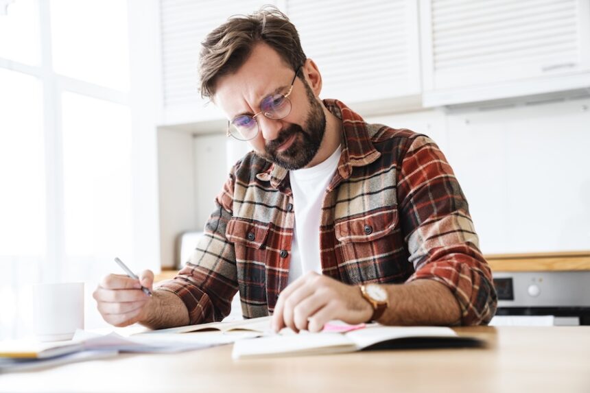 portrait of young bearded displeased man working w 2025 02 15 06 26 47 utc