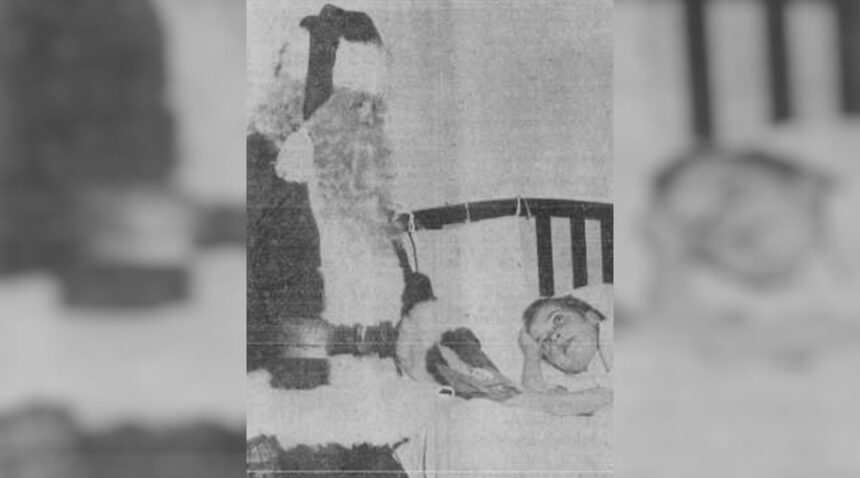 Helping this little girl to forget her troubles is Santa Claus himself. William Collins, above, the jolly old man, is shown giving a sack of candy to little Helen Brown, 9, daughter of Mr. and Mrs. Marvel Brown, of Rigby, Route 1, at the Idaho Falls LDS Hospital. Santa visited the hospital in behalf of the Idaho Falls junior chamber of commerce of which he is a member. He is scheduled to arrive by sleigh Friday at 6:30 p.m. to thrill hundreds of children in front of the public library in the annual Jaycee Children's Christmas Party. Caption dated Dec. 23, 1949.