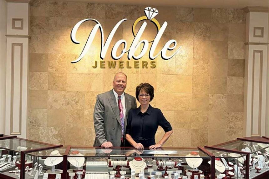 Scott and Hollie Noble pose for a photo in the store at 7 West Main Street in Rexburg. The signage for Noble Jewelers won't be installed until next week. The sign above is AI-generated. | Courtesy Hollie Noble