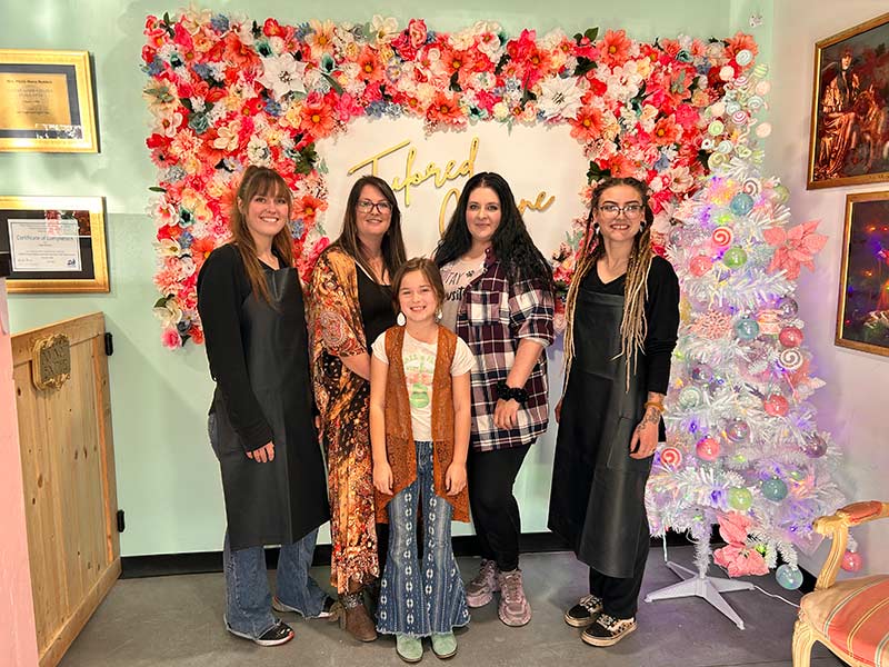 Mistie Badders, second from left, and the rest of the team at Tailored Canine in Rigby. | Rett Nelson, EastIdahoNews.com