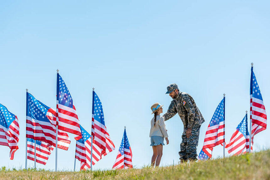 veteran and girl with flags