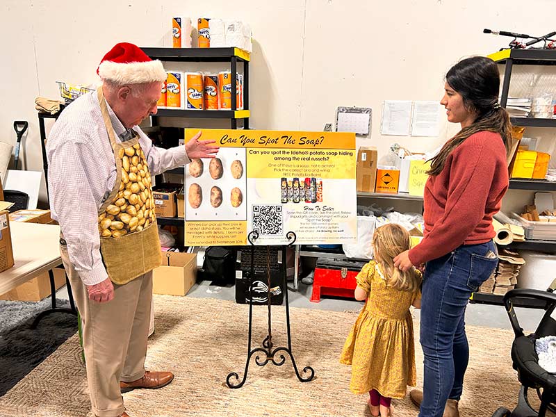 Walker showing a display to a customer in his shop in Idaho Falls | Rett Nelson, EastIdahoNews.com