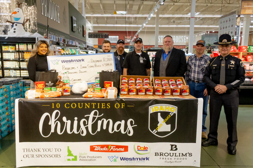 Members of Westmark Credit Union, Broulims, Idaho Pork Producers Assocaition and Idaho State Police at the kickoff of the "10 Counties of Christmas" food drive. | Daniel V. Ramirez, EastIdahoNews.com