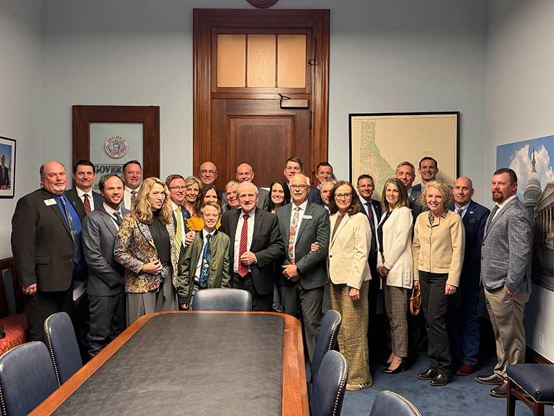 Legislators and farmers pose for a photo inside U.S. Senator Jim Risch's office in Washinton, D.C. | Courtesy Kevin Cook