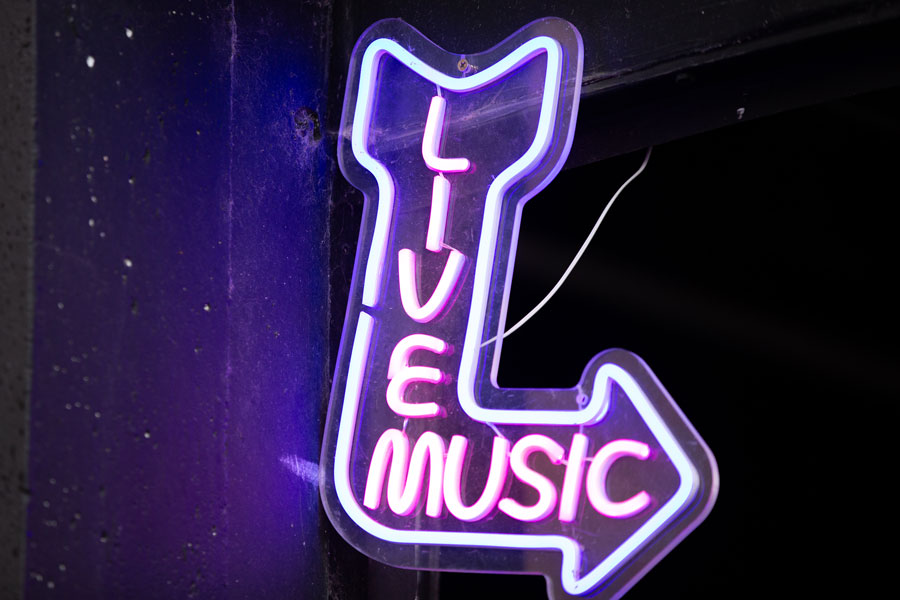 A sign for live music glows outside The Heart Events. | Cody Roberts