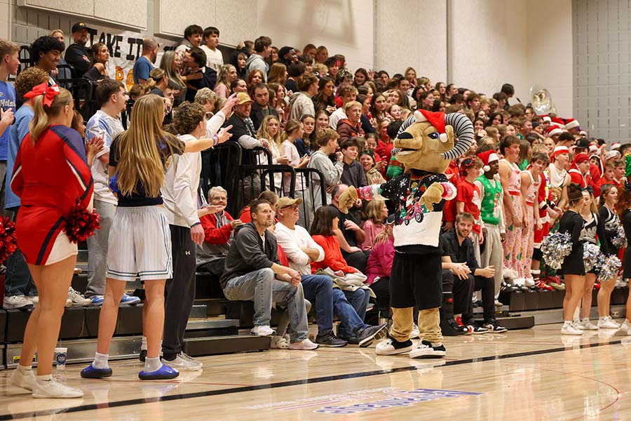 The Pocatello student section goes back and forth with the Highland mascot