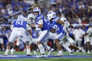 BYU quarterback Bear Bachmeier looks to hand off against Georgia Tech during Saturday’s Pop-Tarts Bowl in Orlando, Fla. | Nathan Ray Seebeck, Imagn Images.
