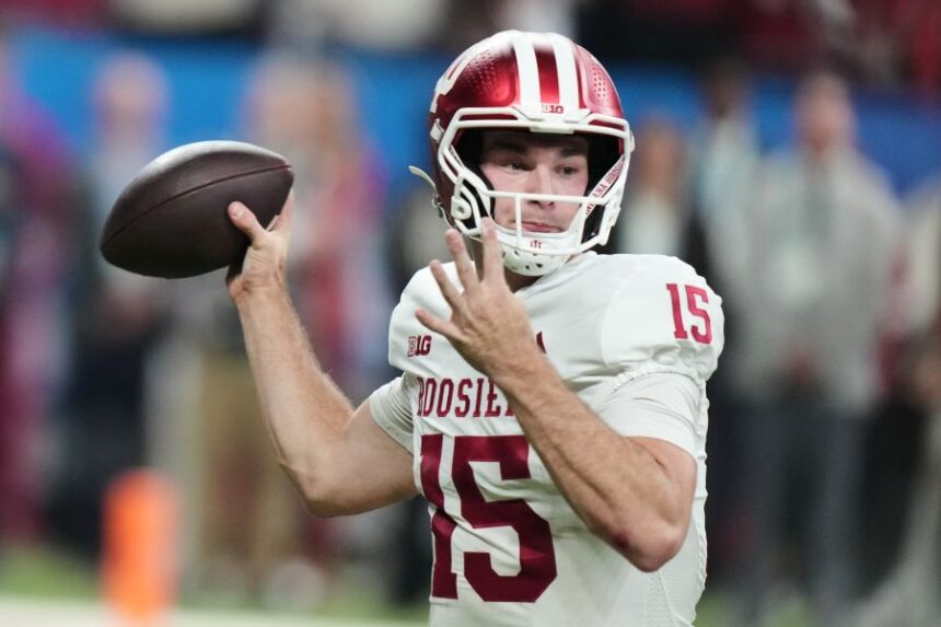FILE - Indiana's Fernando Mendoza throws during the first half of the Big Ten championship NCAA college football game against Ohio State in Indianapolis, Saturday, Dec. 6, 2025. (AP Photo/AJ Mast, File)