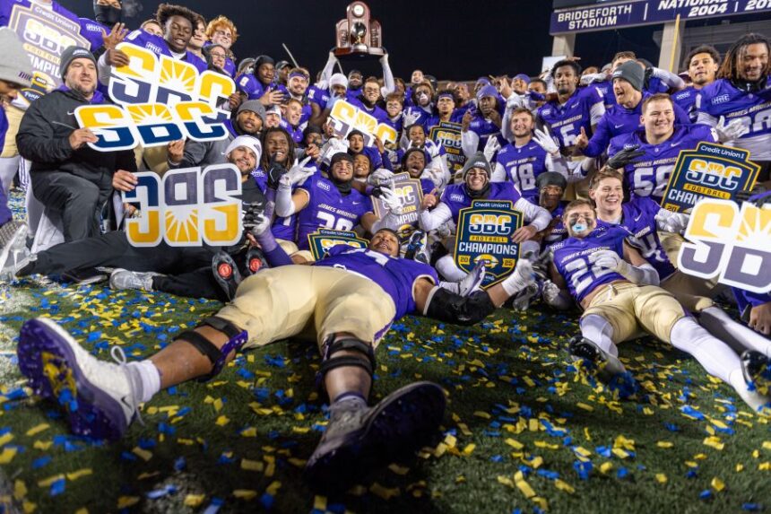 James Madison team celebrates after winning the Sun Belt championship NCAA college football game against Troy, Friday, Dec. 5, 2025, in Harrisonburg, Va. (AP Photo/Robert Simmons)