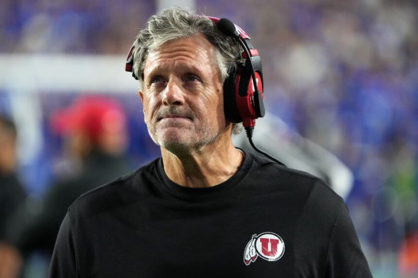 FILE - Utah head coach Kyle Whittingham looks at the scoreboard during the first half of an NCAA college football game, against BYU, Oct. 18, 2025, in Provo, Utah. (AP Photo/George Frey, File)