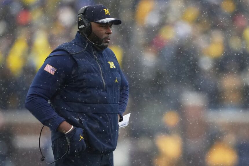 Michigan head coach Sherrone Moore watches from the sideline during the second half of an NCAA college football game against Ohio State, Saturday, Nov. 29, 2025, in Ann Arbor, Mich. (AP Photo/Ryan Sun)