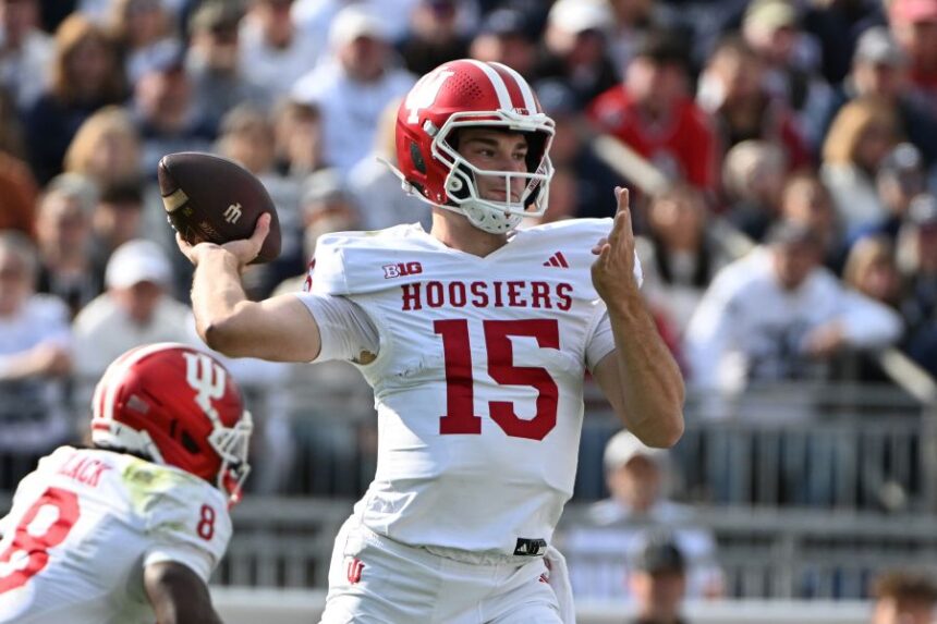 FILE - Indiana quarterback Fernando Mendoza (15) throws a pass during the first half of an NCAA college football game against Penn State , Saturday, Nov. 8, 2025, in State College, Pa. (AP Photo/Barry Reeger, File)