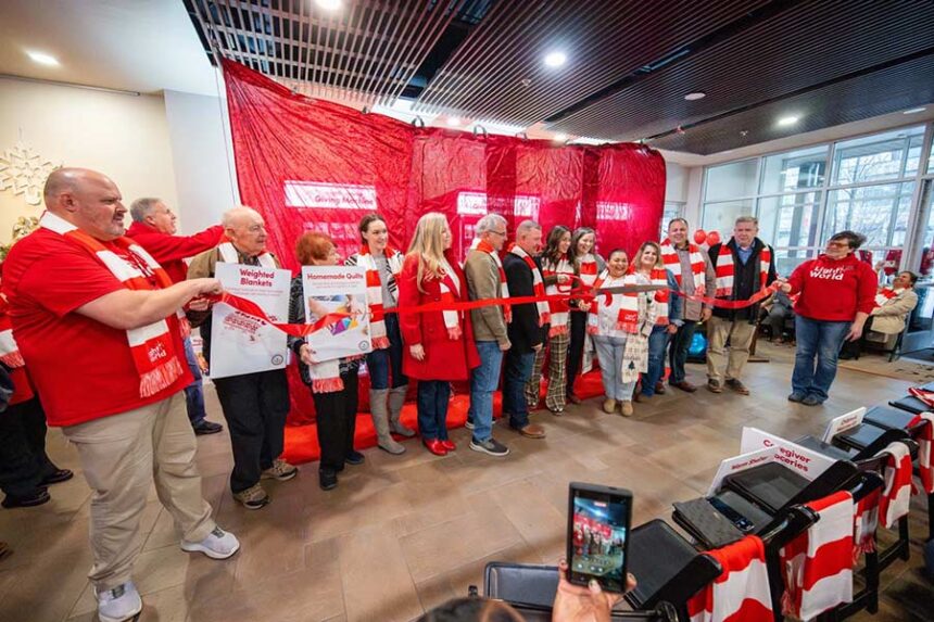 Local charities, volunteers and community members cut the ribbon to open the Giving Machines at the Giving Machine ribbon cutting event at Hemming Village in Rexburg Idaho. | Courtesy Brigham Young University-Idaho