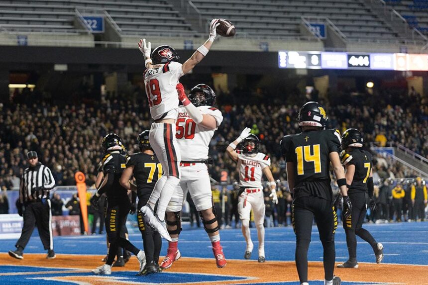 Hillcrest football Austin Reeves (50) celebrates Trezden Thomson (19) TD