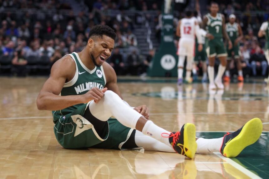 Milwaukee Bucks' Giannis Antetokounmpo reacts after suffering an injury during the first half an NBA basketball game against the Detroit Pistons, Wednesday, Dec. 3, 2025, in Milwaukee. (AP Photo/Kylie Bridenhagen)