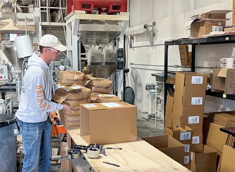 Employee preparing einkorn flour for shipping | Rett Nelson, EastIdahoNews.com