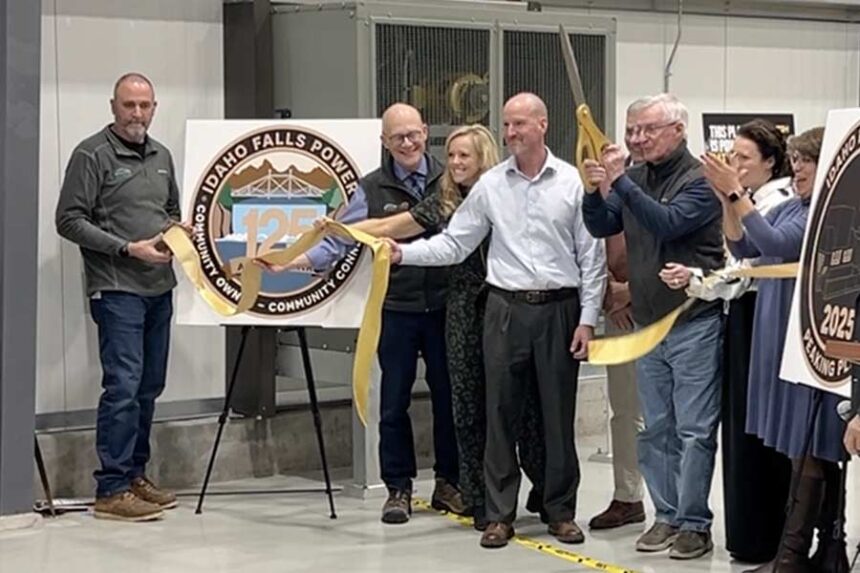 Former City Councilman Thomas Hally cut the ribbon during a celebration of the completion of Idaho Falls Power's Peaking Power Plant at 2017 East Iona Road. | Rett Nelson, EastIdahoNews.com