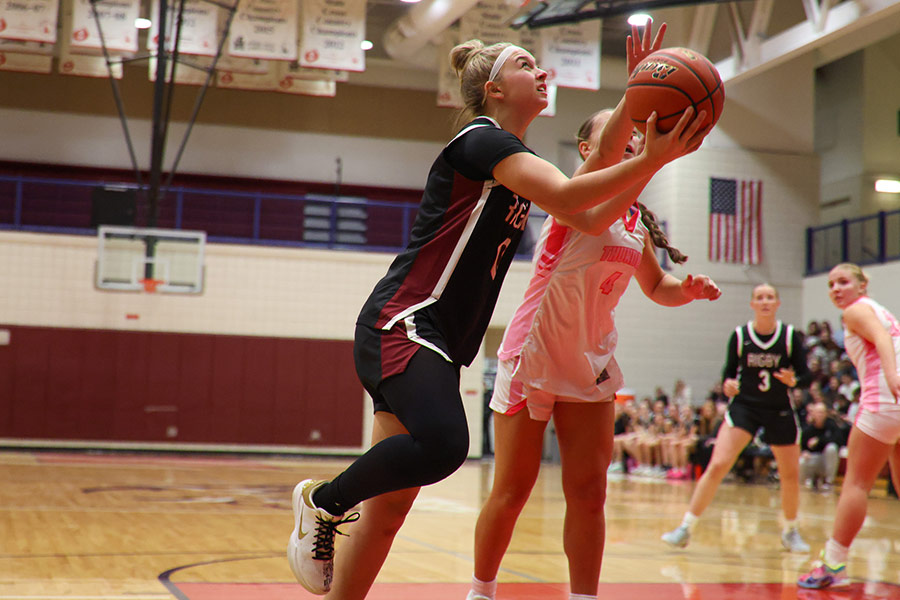 Rigby Kinzley Larsen attacks the hoop against Pocatello Camryn Tatom