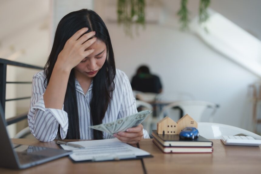 stressed asian businesswoman having financial prob 2025 09 10 03 58 45 utc