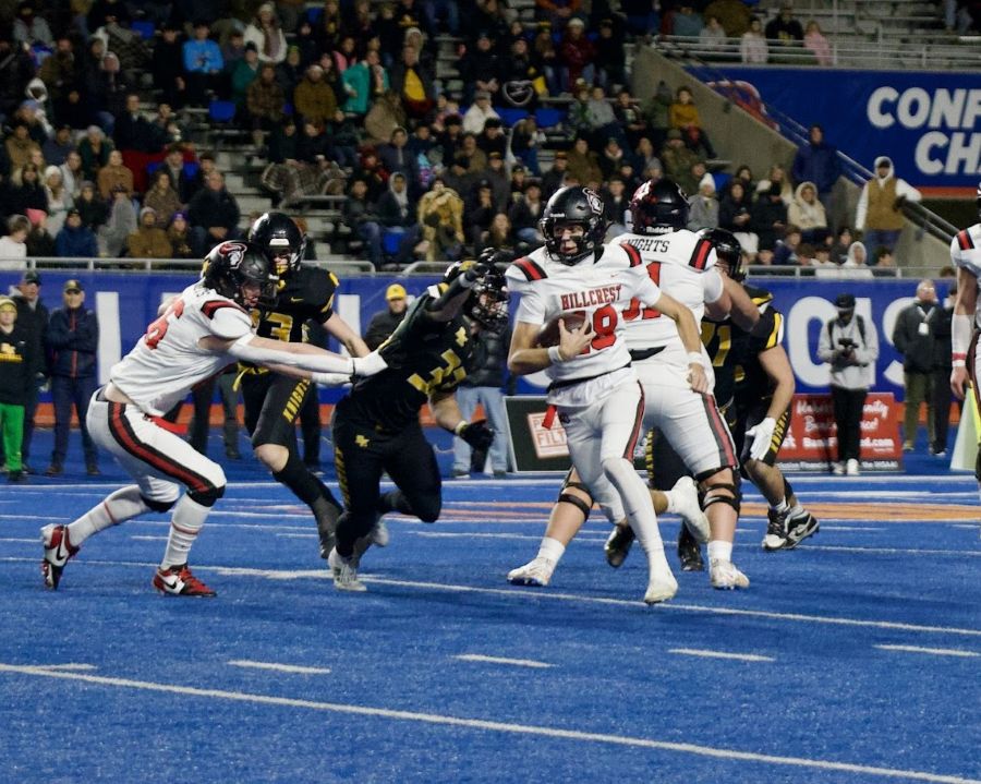 Hillcrest quarterback Tyson Sweetwood looks for running room in the 5A state title game against Bishop Kelly. | Courtesy Amy Ward.