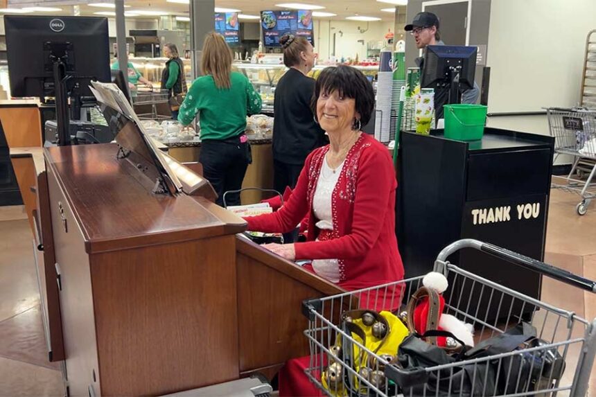 Vonnie Lue Broulim, 88, wife of Broulim's owner Dick Broulim, plays the organ for customers every year at Christmastime. | Rett Nelson, EastIdahoNews.com