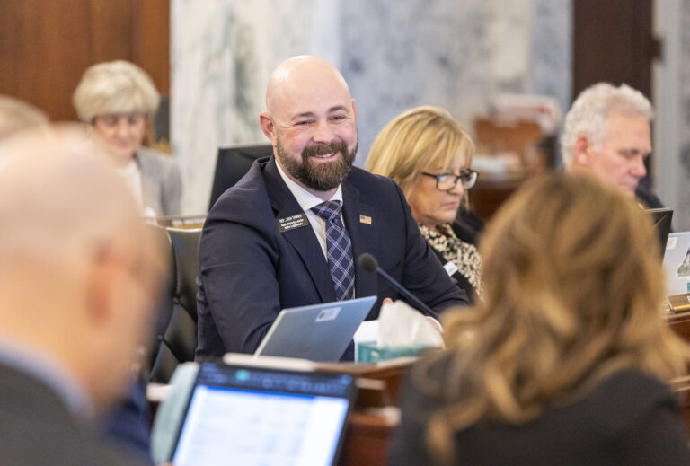 Idaho state Rep. Josh Tanner, R-Eagle, talks with colleagues during the Joint Finance-Appropriations Committee meeting on Jan. 7, 2025, at the State Capitol Building in Boise. (Pat Sutphin for the Idaho Capital Sun)