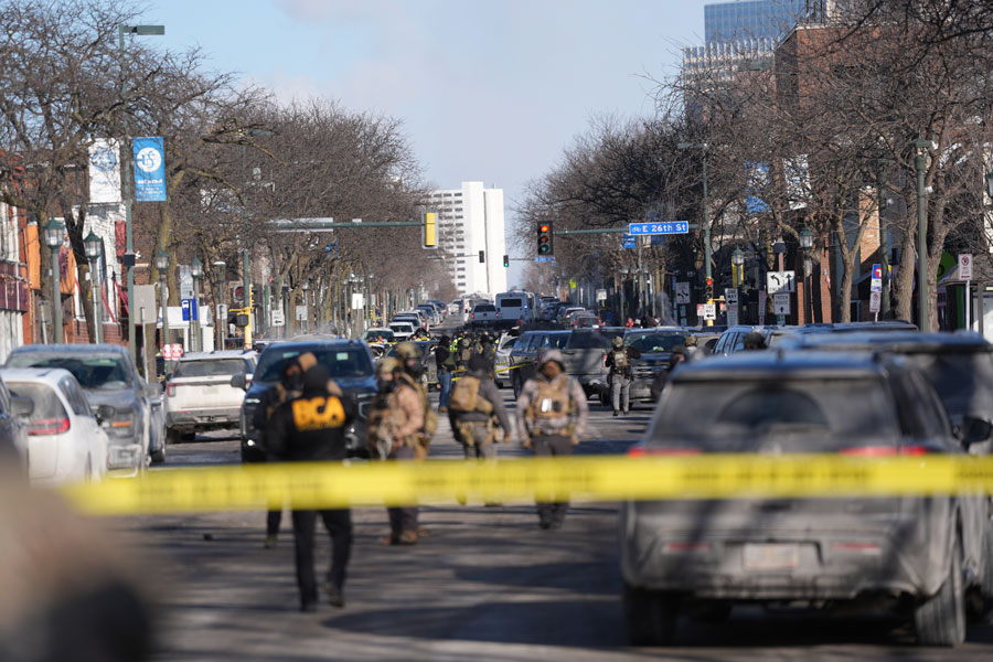 Federal agents stand near the site of a shooting Saturday, Jan. 24, 2026, in Minneapolis. | Abbie Parr, Associated Press