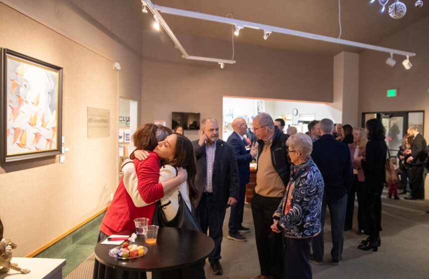 Idaho Falls’ outgoing mayor, Rebecca Casper, hugs a community member as others line up to talk to her Wednesday. | Cody Roberts, EastIdahoNews.com