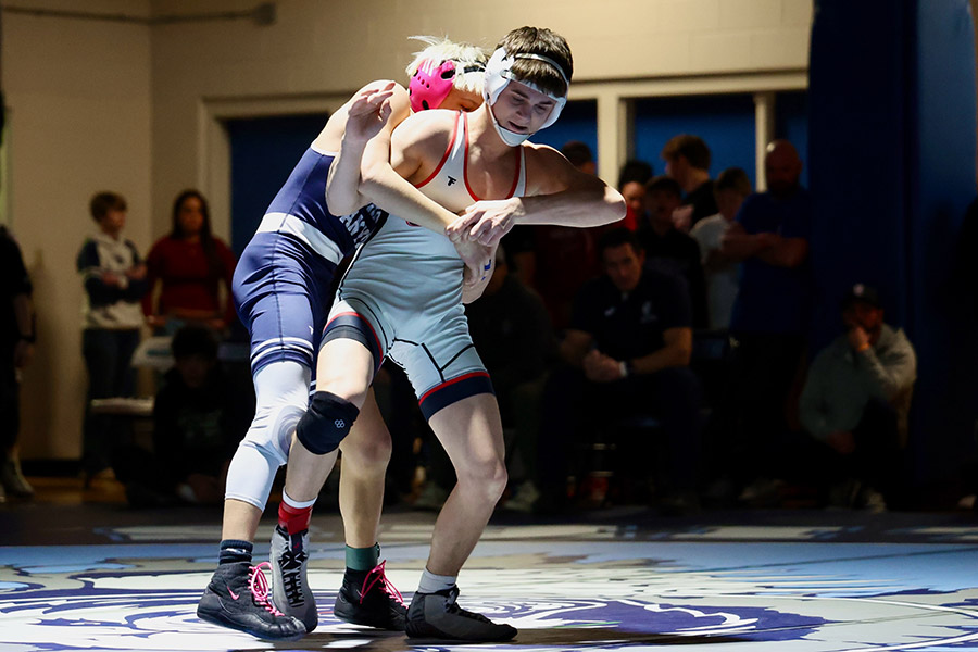 Greysen Packer of South Fremont (white singlet) battles Kacen Jones of Corner Canyon in the 120-pound finals Saturday at the Tiger-Grizz Invitational. | Kyle Riley, EastIdahoSports.com.