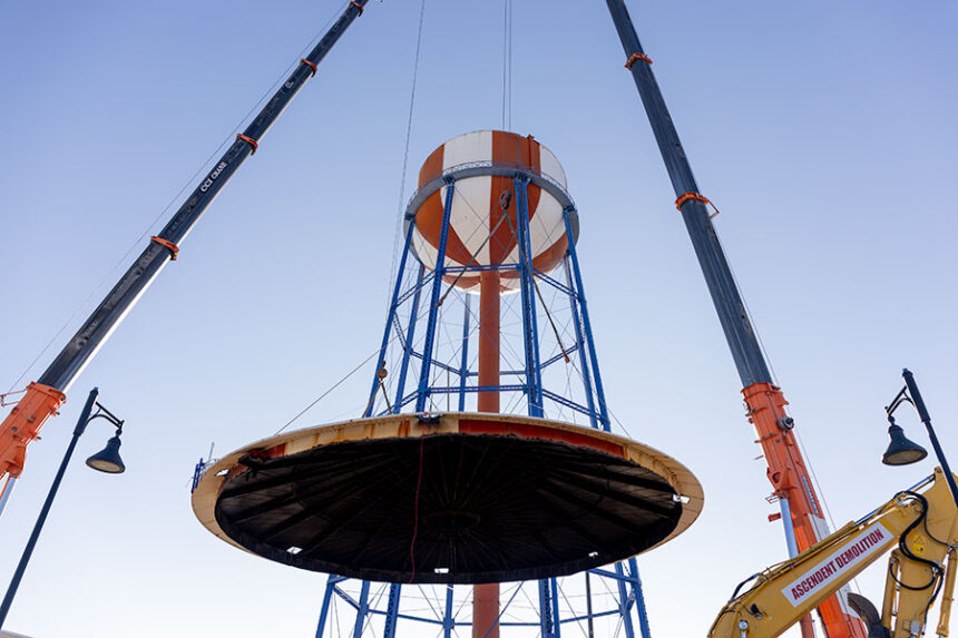 Crane operators with Ascendent LLC lowering the top of the old Idaho Falls Water Tower Wednesday afternoon.| Daniel V. Ramirez, EastIdahoNews.com