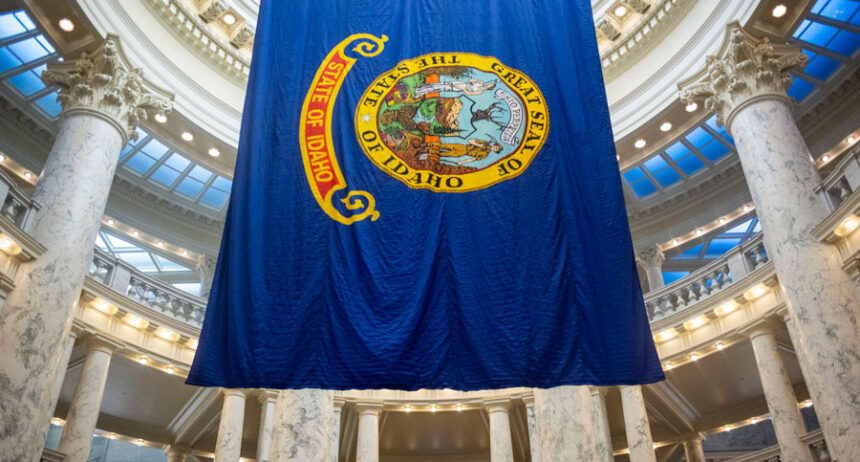 The state flag hangs from the rotunda of the Idaho State Capitol Building in Boise on Jan. 7, 2025. | Pat Sutphin for the Idaho Capital Sun
