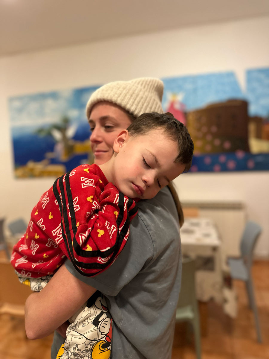 Jacob, the youngest of the children, asleep at the Children's Center with a family member. | Courtesy of Jill Seymour