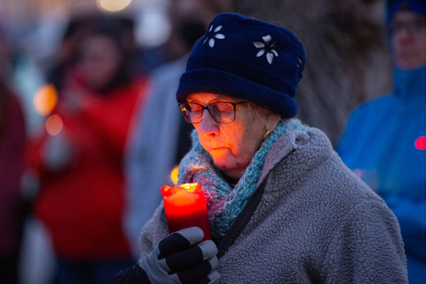 _MG_6890: A community member holds a candle at the Bonneville County Courthouse Sunday evening. | Cody Roberts, EastIdahoNews.com