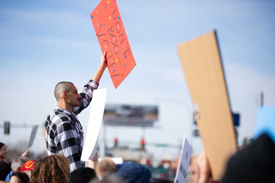 Edward Omar Sandoval stands on Broadway Bridge during an “ICE out” rally in Idaho Falls on Saturday, Jan. 31, 2026. Sandoval said he was born in Houston, Texas, and has Native American ancestry, but is afraid of federal officials coming after him or shooting him.