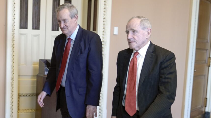 Sen. Mike Crapo, R-Idaho, left and Sen. Jim Risch, R-Idaho, right, walks through the U.S. Capitol Wednesday, Feb. 7, 2024, in Washington. | Mariam Zuhaib, Associated Press