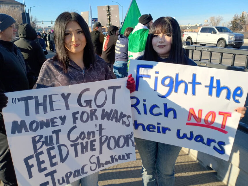 Two protesters on the Broadway Bridge on Saturday, Jan. 17. | David George, EastIdahoNews.com